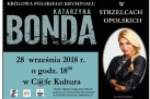 Plakat zapowiada spotkanie autorskie z Katarzyną Bondą, „królową polskiego kryminału”, które odbyło się 28 września 2018 roku w C@fe Kultura w Strzelcach Opolskich. Obok widnieje zdjęcie autorki.